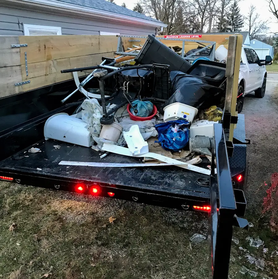 Roll-off dumpster delivered to a residential driveway in St. Ann